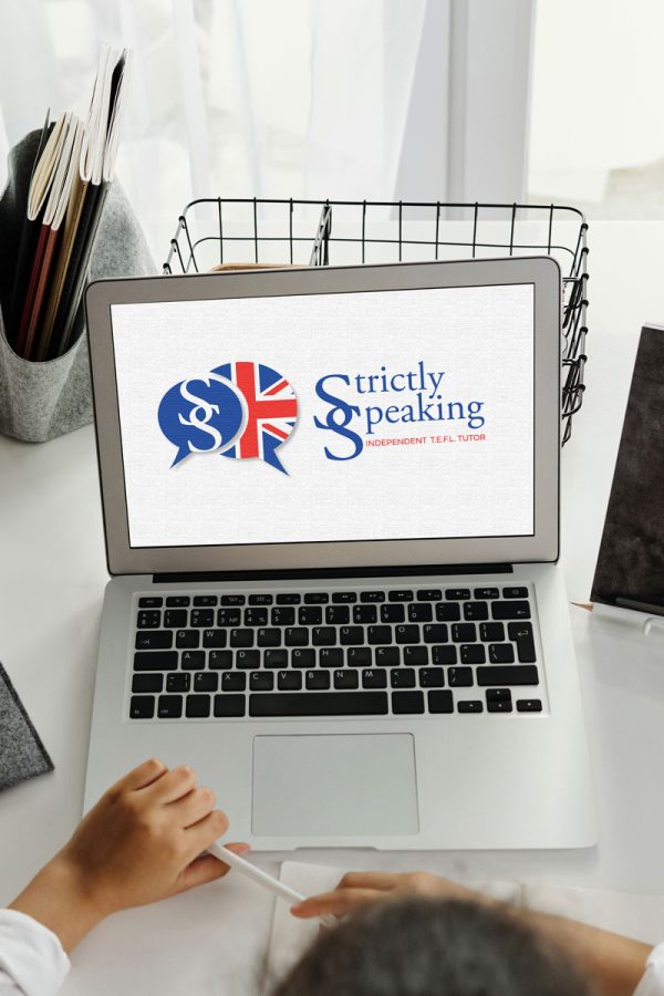 Laptop computer with Strictly Speaking logo onscreen